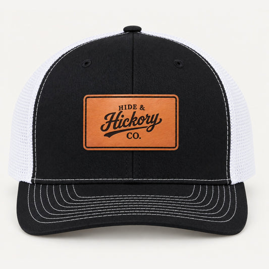 Hide & Hickory Classic Logo Leather Patch Trucker Hat in Black/White, front view